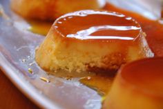 two pieces of cake with caramel sauce on top, sitting on tin foil and ready to be eaten