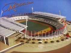 a model of a soccer stadium with palm trees