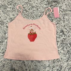 Size L. Color Pink W/ Strawberry Shortcake Graphic. Crop Tank. Non-Adjustable Straps Target Shirts, Target Shirt, Tanktop Girl, Tank Top Cami, Cami Tanks, Strawberry Shortcake, Crop Tank, Christmas List, Pink Red