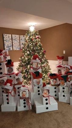 a christmas tree is decorated with snowmen and presents