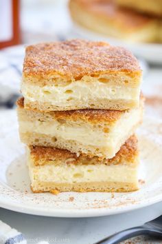 three pieces of cake sitting on top of a white plate