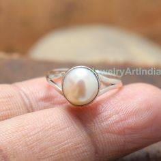 Pearl Ring, Natural Gemstone Ring, Handmade Band Ring, 925 Sterling Silver Ring, Gift For Her, Love Ring, Birthstone Ring, Anniversary Ring About Product:- Gross weight: 3.50 grams according ring size Ring Height & Width: 7x7 mm approx. Band Thickness: 3mm Approx. Gemstone Used: Pearl Metal Used: Solid 925 Sterling Silver Stamp Mark: 925 Metal Color: Shiny Silver Listing is For One (1) Piece Ring. These items are handmade. Jewelry Related: 925 Silver Ring, Middle Finger Ring, Sterling Silver White Birthstone Ring Gift With Round Stone, Fine Jewelry Sterling Silver Pearl Ring With Oval Shape, Oval Sterling Silver Pearl Ring In Fine Jewelry Style, Fine Jewelry Oval Pearl Ring In Sterling Silver, Oval Sterling Silver Pearl Ring, Classic Rings With Stone Setting, White Round Stone Ring As A Gift, White Sterling Silver Stackable Rings With Gemstone, White Crystal Solitaire Ring As Gift