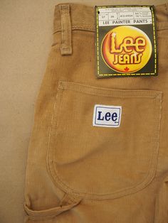 Unworn, originating from the archive of a jeans shop that closed down late last century.  Vintage Lee Painter Pants from the 70s in a light brown wide-wale corduroy.  Made in Canada from 84% cotton and 16% polyester They close with a Lightning zipper and snap button. Pockets in the front and back, hammer loop on the leg.  Waist: 72cm / 28.5'' Front rise: 30.5cm / 12'' Seat: 98cm / 38.5'' Inseam: 90cm / 35.5'' Label size W27 L36, equivalent within the range of a modern XS Lee Corduroy Jeans, 70s Corduroy, Pull Up Pants, Painter Pants, Painters Pants, Lee Jeans, Pull Up, Label Sizes, Jeans Shop