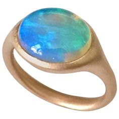 Dalben design One of a kind 18 kt rose gold matte finishing ring with a 4,32 carat bezel-set oval deep light blue lovely Australian Opal . Ring size 7 1/4 - EU 55 re-sizable to most finger sizes. Bezel setting dimension: max width 15 mm, max height 11,4 mm. The ring has been designed and handcrafted in our atelier in Italy Como with a rigorous quality workmanship . Round Opal Ring, Opal Rose Gold Ring, Italy Como, Rose Gold Opal Ring, Jewelry Wishlist, Australian Opal Ring, Opal Diamond Ring, Ring Inspiration, Red Tourmaline