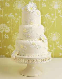 a white wedding cake sitting on top of a table