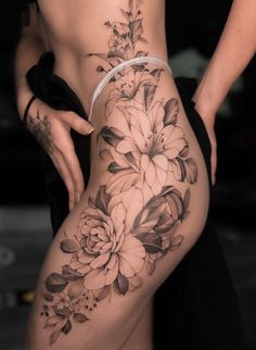 a woman's thigh with flowers on it