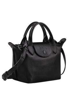 This scaled-down leather version of Longchamp's Le Pliage boasts the same foldaway design that made the bag a worldwide cult favorite. Top carry handles and a removable crossbody strap add to its ingenious versatility. Structured silhouette with flat base for stability Logo-jacquard lining Leather Imported Small Leather Bag, Longchamp Bags, Bottega Veneta Shoulder Bag, Black Leather Handbags, Mini Handbags, Chic Accessories, Small Crossbody, Nylon Bag, Women Accessories Bags