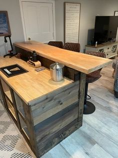 a kitchen island made out of pallet wood