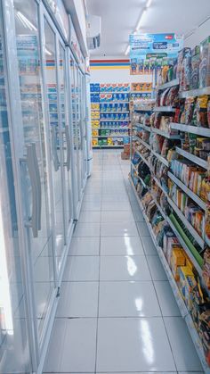 an aisle in a grocery store filled with lots of food