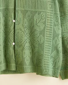 This shirt is made from a heavy-crocheted tablecloth from the 1930s-1950s, overdyed green. Crocheting has historically been an easy way to make lace for decorative use and clothing. Hand-mending throughout. Five front buttons Dry clean only View all one-of-a-kind All wear, mending, and idiosyncrasies are unique to the Crocheted Tablecloth, Moss Wall, Dry Clean Only, Long Sleeve Shirt, Table Cloth, Sleeve Shirt, Button Down Shirt, Long Sleeve Shirts, Dry Clean