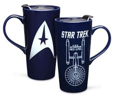 two star trek coffee mugs are shown