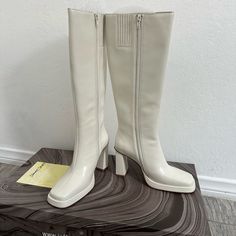 Brand New. In Ivory Color, No Longer Need This Since I Have It In Black! Perfect For Tall Or Short Girls Since This Doesn’t Go Over The Knee. True To Size! Classic Cream Boots For Formal Occasions, Chic Off White Boots For Fall, White Square Toe Heeled Boots For Winter, White Square Toe Winter Boots, Formal Cream Leather Boots, White Heeled Boots With Padded Heel, Medium Width, White Heeled Boots With Padded Heel, White Heeled Boots With Reinforced Heel And Square Toe, White Heeled Boots With Square Toe And Reinforced Heel