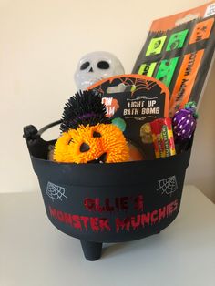 a basket filled with halloween items on top of a table