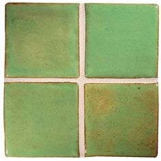 a green tile with four squares in the middle and one square at the top, on a white background