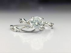 a white diamond ring on a table