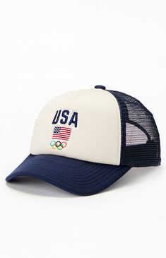 PacSun Exclusive! Showcase your patriotic spirit with the Olympics Team USA Trucker Hat, featuring a breathable mesh back and adjustable snap closure for a perfect fit. The front panel proudly displays the Team USA logo, making it a stylish and functional accessory for any fan.


	Mesh back
	USA Olympics embroidery
	Adjustable snapback closure Sporty Navy Trucker Hat For Baseball Season, Summer Mesh Trucker Hat For Sports Events, American Style Adjustable Trucker Hat For 4th Of July, American Style Adjustable Trucker Hat For Memorial Day, Navy Sporty Trucker Hat For Sports Events, Patriotic Hats For Sports On Memorial Day, Navy Baseball Cap Trucker Hat For Sports Events, Adjustable Blue Trucker Hat For 4th Of July, American Style Adjustable Trucker Baseball Cap