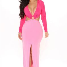 a woman wearing a pink dress with cutouts on the sides and a slited neckline