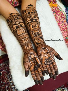 two hands with henna designs on them