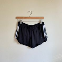 Y2k 00s era vintage adidas shorts. very short with a mid / low rise. Label: Adidas climalite Material: body: 100% polyester lining: 92% polyester 8% spandex Size on label: M Modern Size: fits a small/medium Good Vintage Condition - a few minor snags. zoom in on photos for details MEASUREMENTS IN INCHES (laid flat double where needed) : WAIST: 15, stretches to 19.5 (meant to sit below belly button)/ HIP: 20 / RISE: 10 / INSEAM: 3 Each vintage piece has been preloved. Minor fading + wear is expected & often adds to the character. All items are cleaned & from a smoke & pet free building. We hope you appreciate this find as much as we do. FINAL SALE Sportswear Running Shorts With Three Stripes, Casual Stretch Athletic Shorts With Three Stripes, Sporty Running Shorts With Three Stripes, Casual Running Shorts With Three Stripes, Sports Athletic Shorts With Three Stripes, Three Stripes Athletic Shorts For Sports, Sporty Three Stripes Athletic Shorts, Sporty Three-stripe Athletic Shorts, Athletic Shorts With Three Stripes For Sports