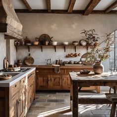 A charming English countryside kitchen with warm, earthy tones that create a welcoming and comfortable environment Kitchen Eclectic, Wabi Sabi Kitchen, English Country Interiors, Large Farmhouse Table, Countryside Kitchen, Kitchen Simple, Country Interior Design, Large Farmhouse, Mixed Patterns