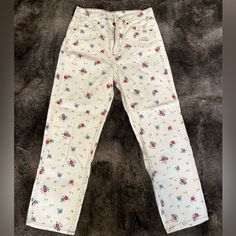 White Wrangler Jeans With Flowers, Never Worn, Still Has Tag Spring Casual Rodeo Jeans, Casual Jeans For Rodeo And Spring, Casual Spring Bottoms For Rodeo, Casual Bottoms For Rodeo In Spring, Retro White Jeans For Spring, White Retro Jeans For Spring, White Cotton Jeans With Floral Print, Casual White Jeans With Floral Print, White Floral Print Cotton Jeans