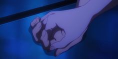 an anime hand reaching for something on the counter in front of it, with blue light coming from behind