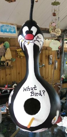 a large black and white bird with the words what bird? painted on it