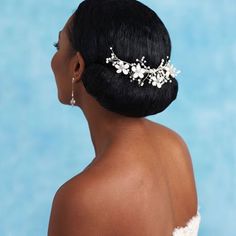 a woman wearing a bridal hair piece