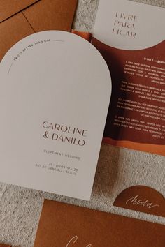 the wedding stationery is laid out on top of each other