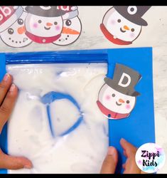 someone is making a snowman letter d craft