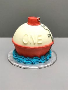 a cake that is shaped like a buoy with the word one on it's side