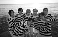 black and white photo of boys in striped shirts