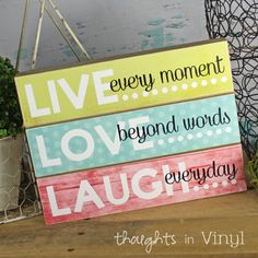 a wooden sign that says live every moment, love beyond words everyday