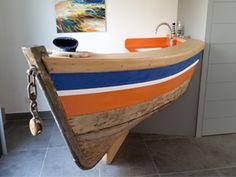 a boat shaped bathtub in the corner of a bathroom