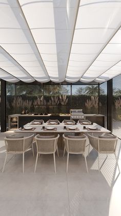 an outdoor dining area with white chairs and tables set up for dinner on the patio