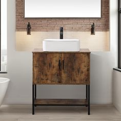 a bathroom vanity with a white sink and brick wall in the background, along with a bathtub