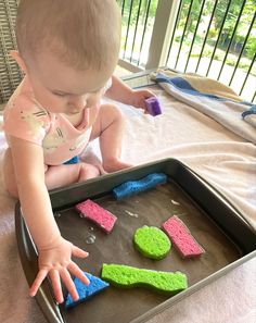 a toddler playing with homemade play dough