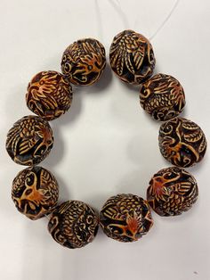 sale price. Wooden Beads For Jewelry Making, Hand-strung Assorted Round Bead Jewelry, Oval Carved Beads For Gifts, Unique Carved Beaded Necklace, Traditional Large Brown Beads, Traditional Brown Large Beads, Brown Round Beads For Gifts, Carved Amber Round Beads Jewelry, Polished Round Brown Beads