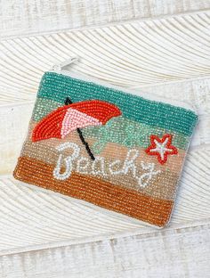 Petite pouch for the beach that’s 5 x 3.5 inches Trendy Beaded Beach Bags, Summer Vacation Beaded Beach Bag, Rectangular Beaded Beach Bag, Beaded Beach Bags For Beach Season, Beach Zipper Pouch, Summer Vacation Zipper Pouch, Rectangular Zipper Pouch For The Beach, Trendy Summer Beach Pouch, Trendy Beach Pouch For Summer