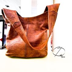 Leather Bag Handmade Bag Brown Bag ## Product Characteristics ## -Dimension : 11.80 inches H * 15.35 inches W  -Color : Brown -Material: 100 % Goat leather -100% Handmade This bag is handcrafted from high quality goat leather. The leather we use is treated with natural materials that make the leather has no unpleasant smell. This bag is the best choice for your day,travels, because it is very cute and durable. ##Note ## We still need your phone number for the shipping company can you please send it! Leather Bag Handmade, Moroccan Leather, Brown Bag, Handmade Bag, Leather Bags Handmade, Goat Leather, Shipping Company, Brown Bags, Shoulder Messenger Bag