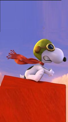 a cartoon dog sitting on top of a red block in front of a blue sky