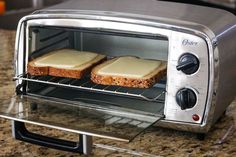 two slices of toaster oven sitting on top of a counter