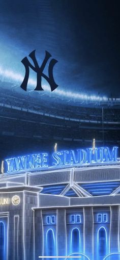 yankee stadium lit up at night with the new york yankees logo in the sky above it