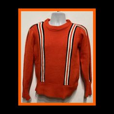 "Vintage 1960s two tone cheerleader sweater by Logan Knitting Mills The pullover sweater is a vibrant orange with contrasting stripes on sleeves and down both sides of chest in white, orange and black. The sweater has a ribbed neckline, cuffs and waistband. The label states Logan Knitting Mills 100% Orlon Cheerleader uniforms sweaters, jackets, and emblems This garment is in vintage condition.  MEASUREMENTS: (All measurements were taken lying flat) Shoulders - 18\" (measured on back of the shirt Cheerleader Sweater, Cheerleader Uniforms, Pom Pom Girl, Ribbed Neckline, Vibrant Orange, Vintage 1960s, Cuff Sleeves, Pullover Sweater, Cheerleading