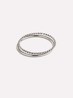 The white gold ring set you’ve been searching for. This timeless set is crafted in solid white gold and features one minimal band ring and one twisted ring for a fun touch of texture. This dainty duo of rings can be worn together, separately, or as a chic addition to any already existing stack. If your look just doesn’t feel finished, we’d recommend pairing this set with our White Gold Huggie Hoops. The White Gold Ring Set includes two pieces: White Gold Ring - White Gold Ring and White Gold Ring - White Gold Twist Ring. • Crafted in solid white gold • Made to last a lifetime • Set of two rings in varying textures Gold Twist Ring, Twisted Ring, Gold Ring Sets, Twist Ring, White Gold Ring, Letter Necklace, White Gold Rings, Band Ring, Ring Set