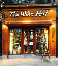 the wine hut is lit up and ready for customers to purchase their wines at night