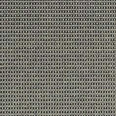 a close up view of the grey fabric textured with small circles and dots on it