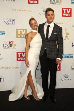 a man and woman posing on the red carpet for tv week awards at crown theatre