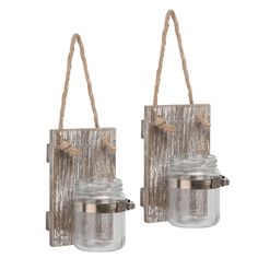 two glass jars with rope hanging from them