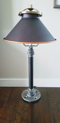 a lamp that is on top of a wooden table